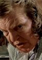 Anne Ramsey's intense expression in "Throw Momma From The Train," showcasing her iconic role as a powerful matriarch.