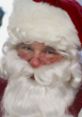 Jolly Santa Claus with a fluffy white beard and red hat, spreading holiday cheer with a warm smile and twinkling eyes.