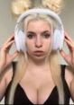 Blonde streamer with headphones, focused expression, showcasing a gaming vibe and style typical of Meowthy Streamer.