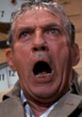 Howard Beale from "Network," passionately screaming about societal discontent, conveying urgent messages through emotion.