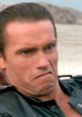 Arnold Schwarzenegger's intense expression in "Raw Deal", capturing a dramatic moment from the action film.