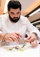 Antonino Cannavaciuolo artfully plating a gourmet dish, showcasing his culinary skills and passion for fine dining.