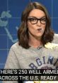 Tina Fey on Weekend Update, humorously discussing Charlottesville protests while enjoying a snack.