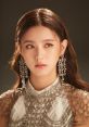 G-IDLE Miyeon showcases elegance with stunning jewelry and a detailed outfit, captivating fans in this striking portrait.