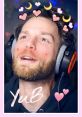 YuB smiling with headphones, playful decorations, showcasing his lively personality and engaging YouTube presence.