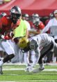 Thompson Football player evades tackle during a high-stakes game, showcasing agility and competitive spirit on the field.