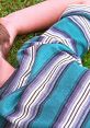 Close-up of a boy's striped shirt in vibrant colors, evoking a nostalgic feel from the Boyhood trailer's themes.