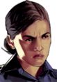 Angry female cop character from Grand Theft Auto V, showcasing fierce expression and determined demeanor in a close-up.