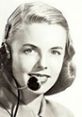 Vintage intercept operator smiling with headset, showcasing classic telecommunications style and early 20th-century aesthetics.