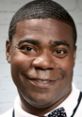 Tracy Morgan as Brian Fellow, showcasing his signature smile and unique style on a set backdrop.