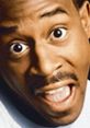 Martin Lawrence showcases his signature comedic expression, exuding energy and enthusiasm with a bright smile.