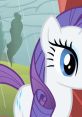 Close-up of Rarity from My Little Pony, showcasing her stylish mane and distinctive cutie mark against a rainy backdrop.