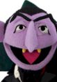 Count von Count from Sesame Street, a purple vampire puppet with a playful grin, counting and enjoying numbers.