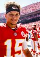 Patrick Mahomes smiles in his Kansas City Chiefs jersey, showcasing team spirit and confidence during a game day.