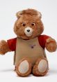 New Teddy Ruxpin plush toy with soft fur, friendly expression, and colorful outfit, perfect for children's adventures and storytelling.