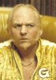 Goldmember from Austin Powers, sporting a gold tracksuit and a serious expression, embodies classic villainy with humor.