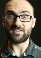 Vsauce host with glasses, displaying curiosity and excitement about science and education in a close-up shot.