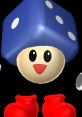 Cheerful character with a blue cube hat and red gloves, embodying the playful spirit of Tumble in gaming.