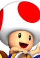 Toad from Mario Kart: Double Dash smiles while driving, showcasing his iconic red and white mushroom cap.