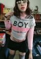 Femboy style featuring a cropped hoodie and mini skirt, showcasing bold fashion choices and playful expression.