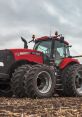 Red Case IH Magnum 380 tractor on a field, showcasing powerful tires and modern agricultural design for efficient farming.