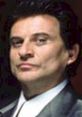 Joe Pesci in a classic gangster look, showcasing his iconic style and intense expression. Renowned actor and comedian.