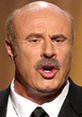 Dr. Phil passionately speaking during a television appearance, showcasing his dynamic personality and engaging style.