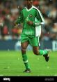 Kanu Nwankwo Type your text to hear it in the voice of Kanu Nwankwo. Amid the vibrant tapestry of a football stadium, the 