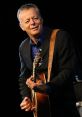 Tommy Emmanuel ian - Australian Guitarist . Type your text to hear it in the voice of Tommy Emmanuel