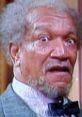 Redd Foxx's iconic shocked expression, showcasing his unique comic talent and memorable character in classic television.