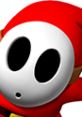 Shy Guy from Mario Kart DS with a red hood, featuring a white mask and black eyes, embodies playful gaming charm.