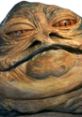 Close-up of Jabba the Hutt, iconic Star Wars character, showcasing his unique features and distinctive facial expression.