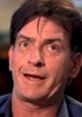 Charlie Sheen with a quirky expression, showcasing his unique personality and charisma during an interview.