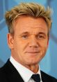 Gordon Ramsay smiling confidently in a suit against a blue background, showcasing his iconic style and charismatic presence.