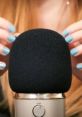 Hands gently adjusting a microphone, perfect for relaxing ASMR 3D sounds for sleeping and deep relaxation.