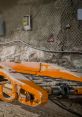 Wipp machinery detail in a dimly lit underground setting, showcasing construction equipment and rugged environment.