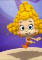 Deema from Bubble Guppies, showcasing her cheerful personality with curly yellow hair and a vibrant orange outfit.