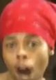 Antoine Dodson reacting passionately during the Bed Intruder news interview, showcasing his iconic red headscarf.