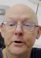 Bald man with glasses speaking, demonstrating engaging content on CyclingMikey's channel about cycling adventures.