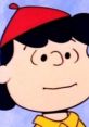 Lucy Van Pelt in a red hat, showcasing her iconic style from the 1965 Peanuts animation series.