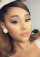 Ariana Grande with elegant makeup and accessories, showcasing her iconic style and beauty. Perfect for beauty inspiration.