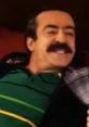 Sinan in Akasya Durağı, smiling and enjoying a moment, showcasing his signature mustache and vibrant personality.