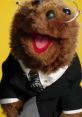 Joe The Legal Weasel puppet in a suit with glasses, showcasing a fun and engaging character for legal education.