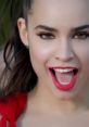 Sofia Carson radiates energy and joy in the "Love Is the Name" music video, showcasing her captivating smile and style.