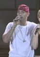 Eminem performs "Stan (Long Version)" with Dido, showcasing his iconic style and powerful vocals on stage.