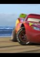 Lightning McQueen races on the beach, showcasing speed and excitement in the "Cars 3: Rivalry" official trailer.