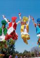 Joyful Bhangra dancers in vibrant traditional outfits leaping against a clear blue sky, celebrating cultural heritage.