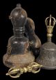 Vintage Ghanta bell and ritual tools, showcasing intricate designs and historical significance in spiritual practices.