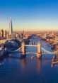 Tower Bridge spans the River Thames with London skyline in the background, showcasing iconic landmarks and vibrant city life.