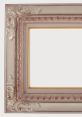 Elegant ornate picture frame with decorative details in soft hues, ideal for enhancing art or photography displays.